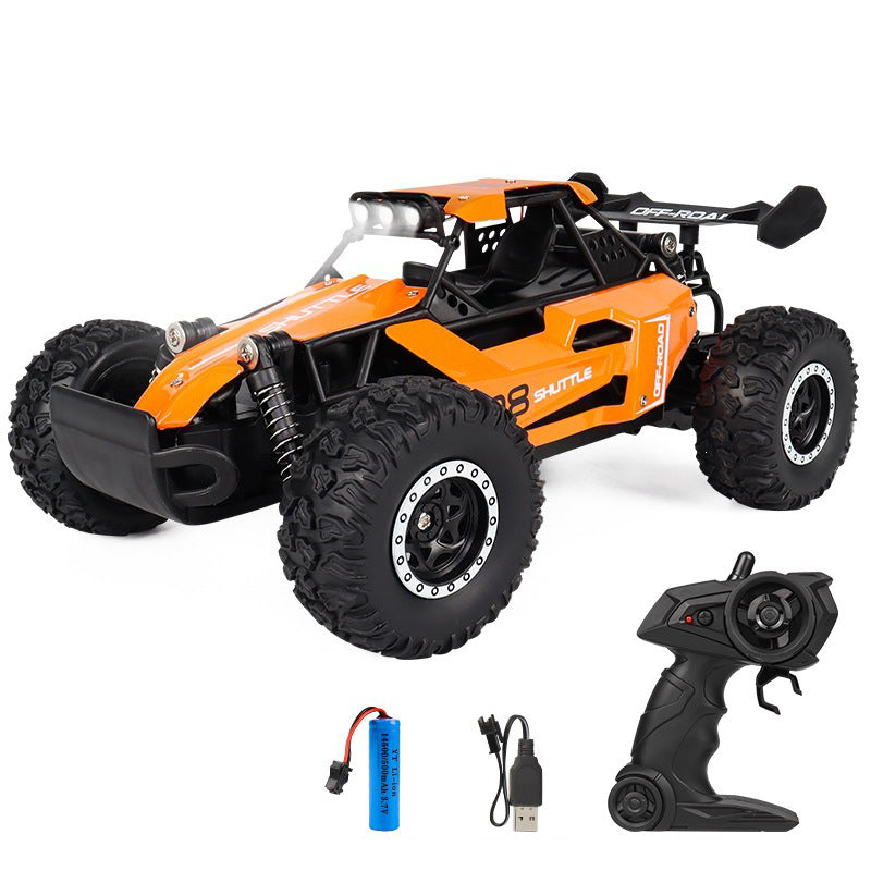 Orange RC off-road car with controller and accessories